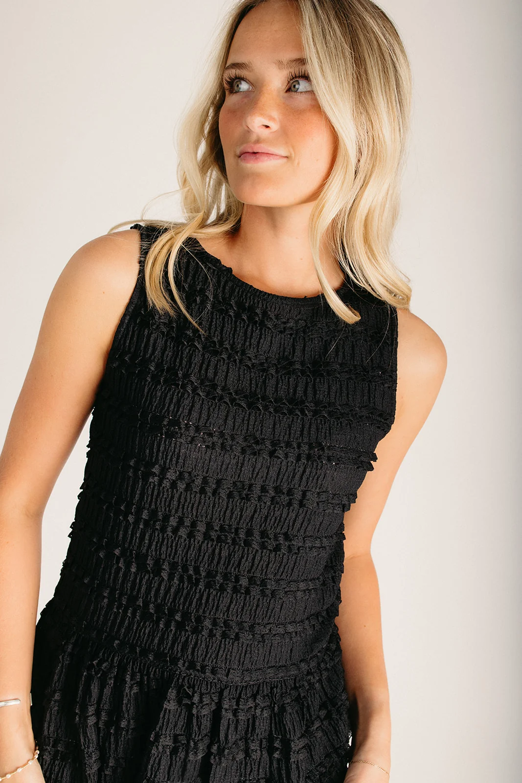 The Arlington Flutter Detail Peplum Tank in Black - Image 4