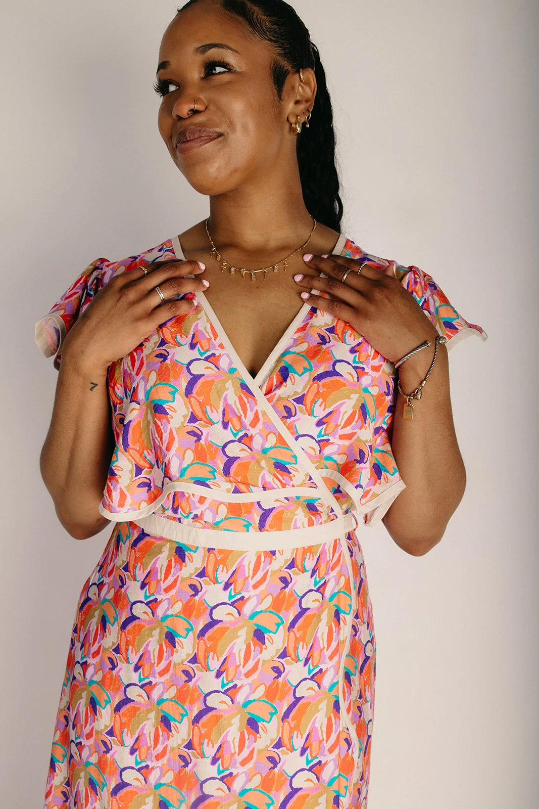 The Longoria Scalloped Hem Wrap Dress in Peach Floral - Image 2