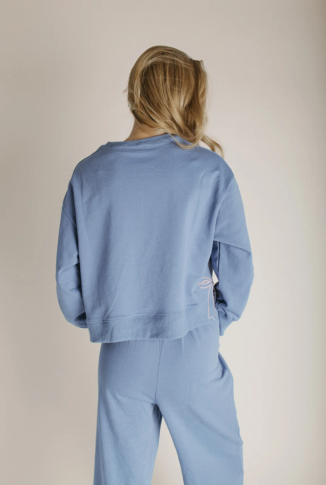The Monzingo Bow Embroidered Pullover in Dusty Blue - Image 4