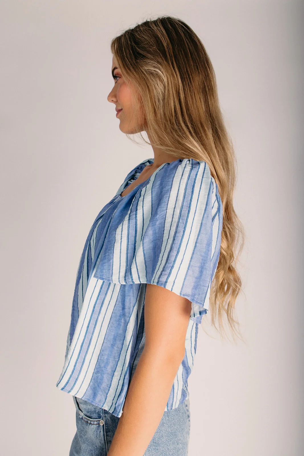 The Rodney Striped Flutter Sleeve Blouse in Blue - Image 6