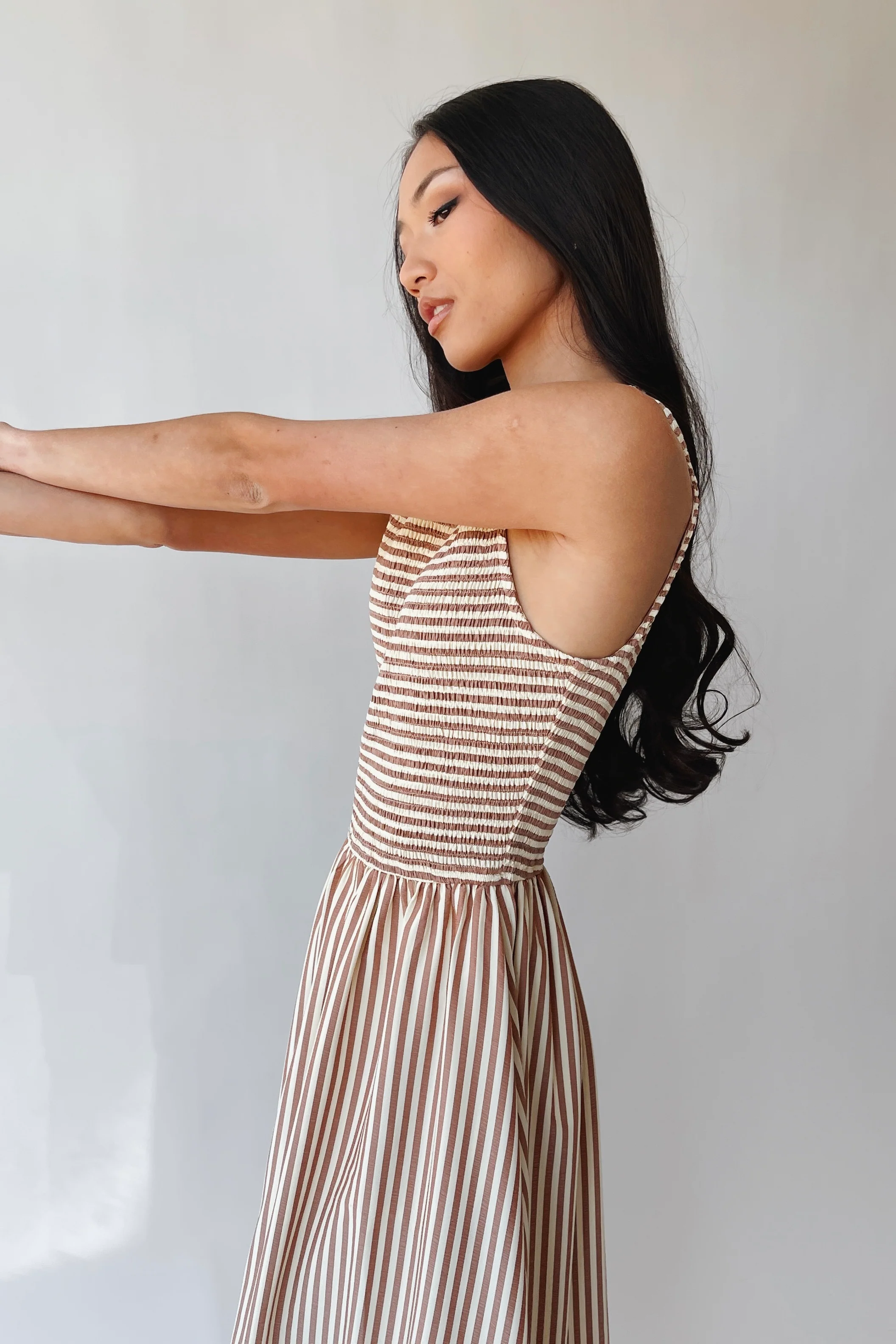 The Sopata Smocked Maxi Dress in Brown Stripe - Image 10